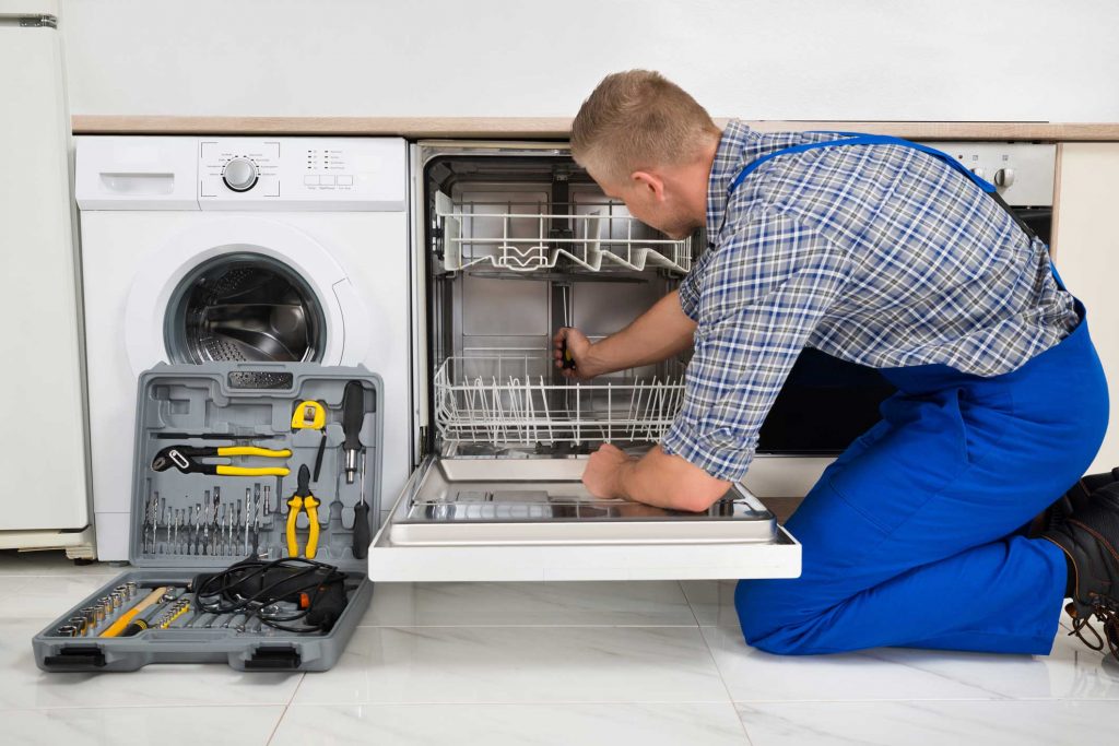 technician fixing a dishwasher repair brooklyn